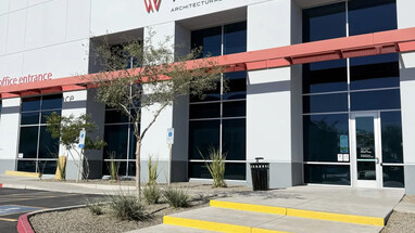 Rebranded Western Architectural Openings building exterior with signage, red awning, and concrete walkway leading to the office entrance.