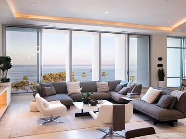 The open bi-parting multi-slide allows for the ocean breeze to refresh the sitting area.