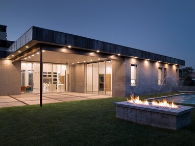 Two massive multi-slide door open from the great room and master suite to a 1,000-square-foot covered outdoor living space.