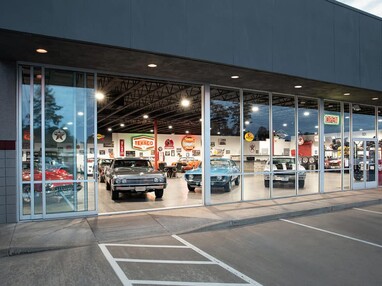 The massive panels of the Series 600 Multi-Slide doors allow vehicles to be driven in and out of the showroom.