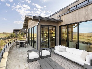 Fixed windows eliminate the barrier to the outdoor patio views.