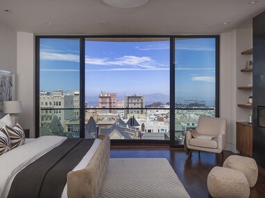 A contemporary-looking parting sliding door in the third-floor master suite provides views of Alcatraz and the San Francisco Bay.