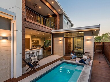 To expand the space at the back of the home, architect Michael Gooden used a 15-foot by 10-foot multi-slide door that disappears into pockets.