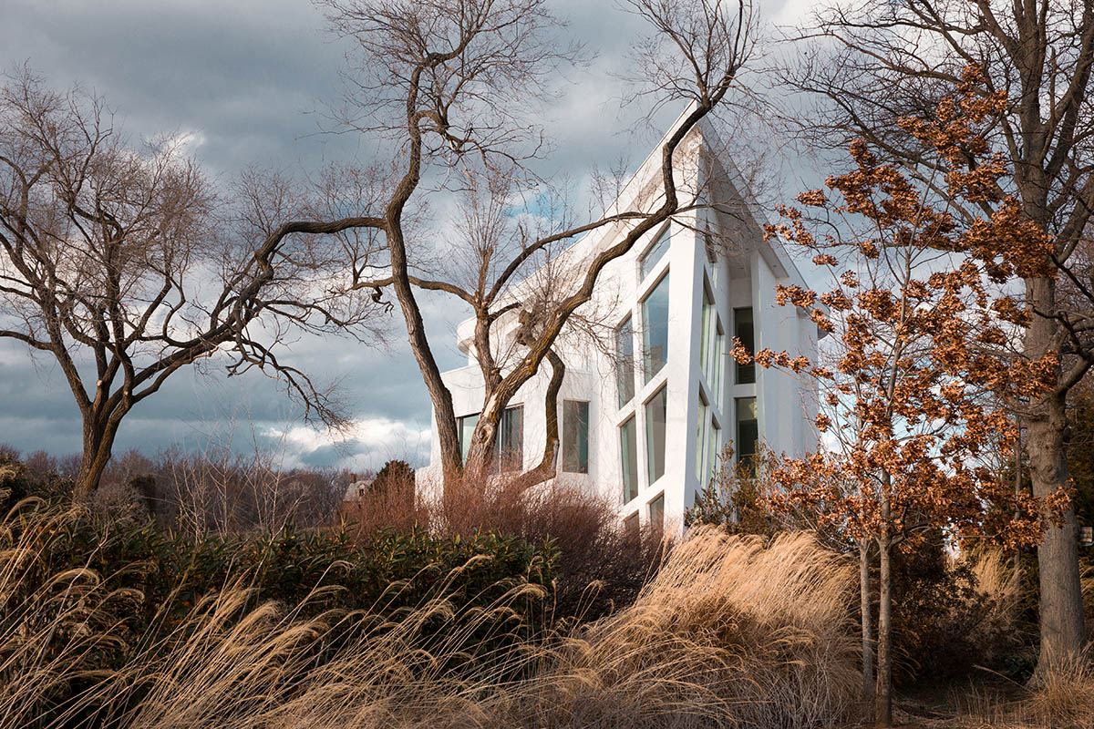 This contemporary home provides unique views with the teardrop-like shape that juts out into the landscape.