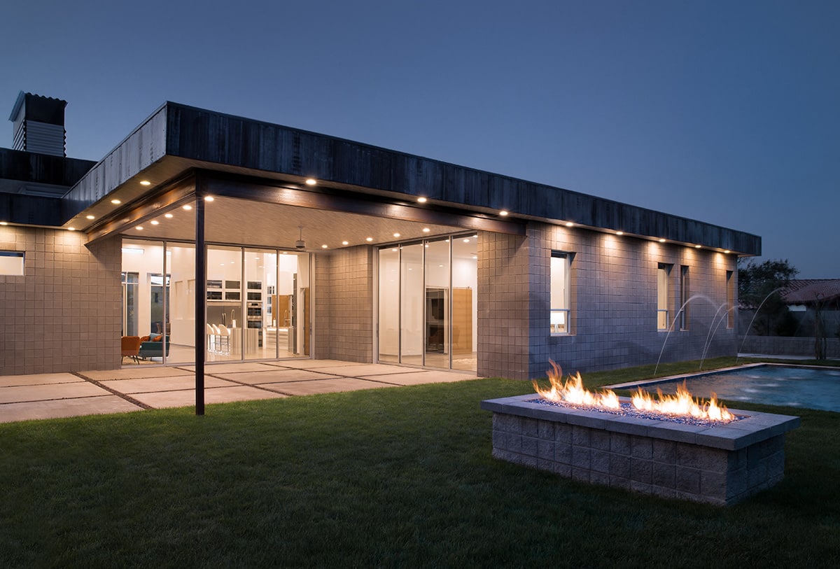 Two massive multi-slide door open from the great room and master suite to a 1,000-square-foot covered outdoor living space.