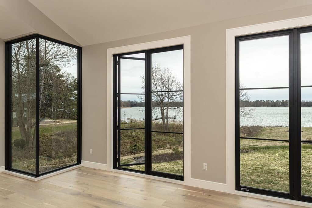 The south side of the home features massive glass across the façade including several 10-foot-tall Series 7670 Casement Windows.