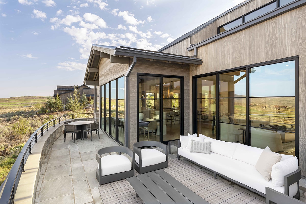 Fixed windows eliminate the barrier to the outdoor patio views.