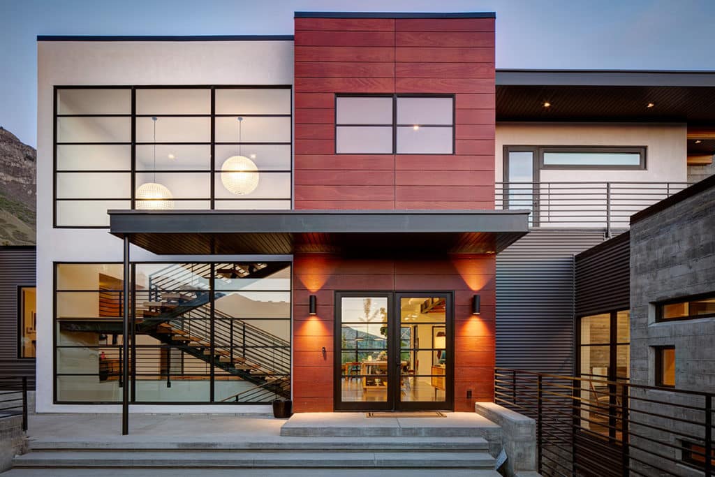 Both stories of the home provide grand views through large windows and glass doors.
