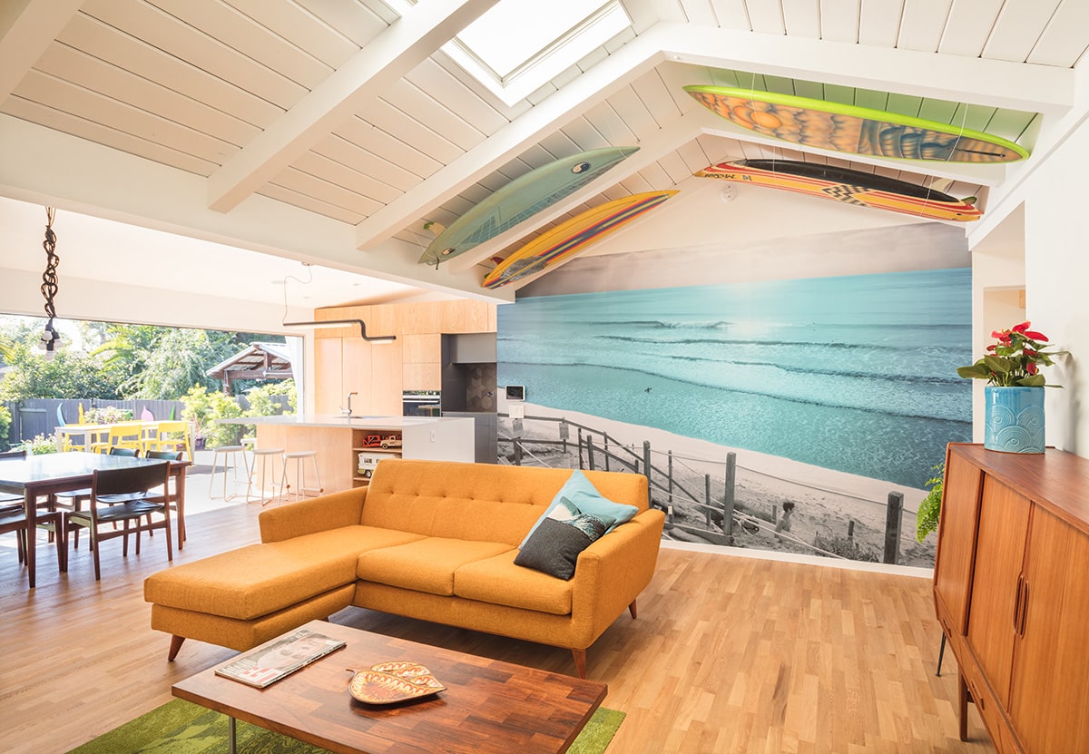 A giant four-panel multi-slide door opens the living room, kitchen, and dining room to the backyard.