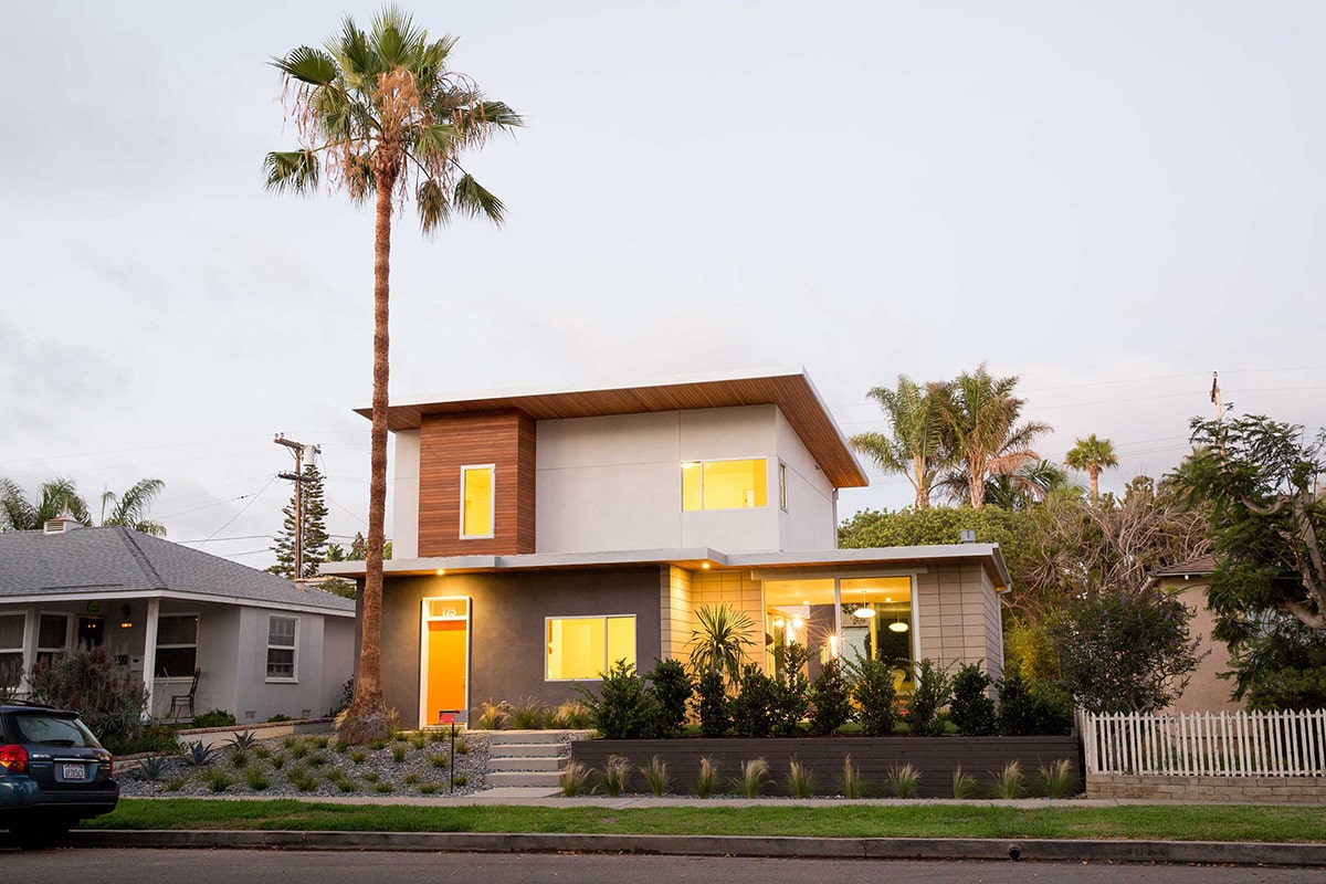 The windows and blend of concrete and wood give this home a modern aesthetic.