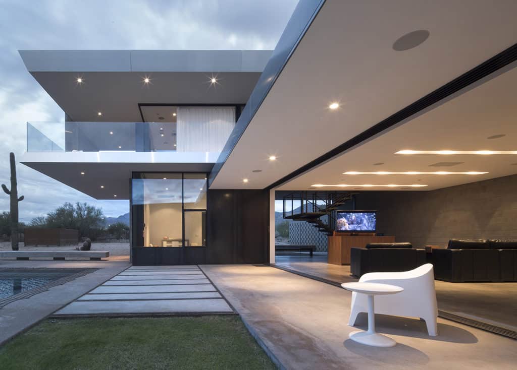 A Series 600 pocketing Multi-Slide Door from Western Window Systems completely and effortlessly opens the living room and kitchen to the beautiful backyard and pool.