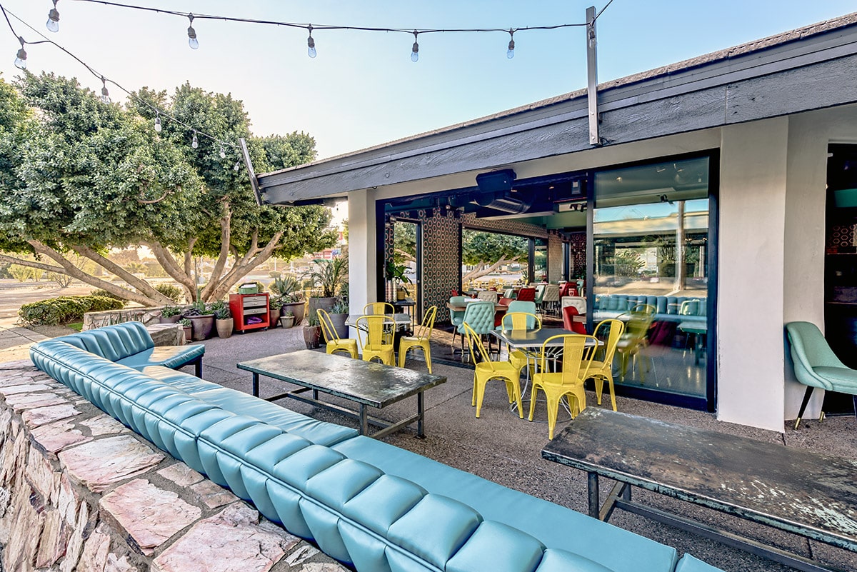 This stacking multi-slide door opens up the main dining room of Joyride to a casual patio dining space.