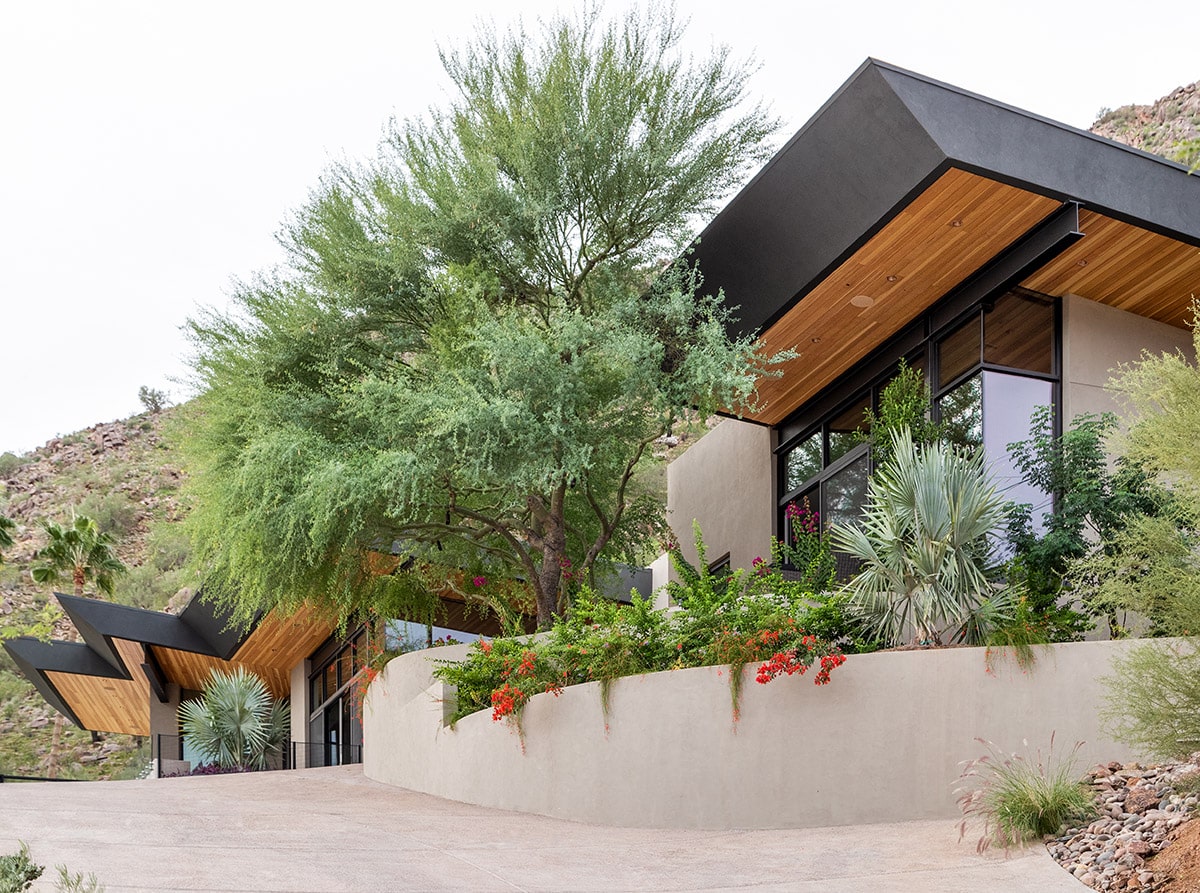 A view of the home’s exterior with several multi-slide doors.
