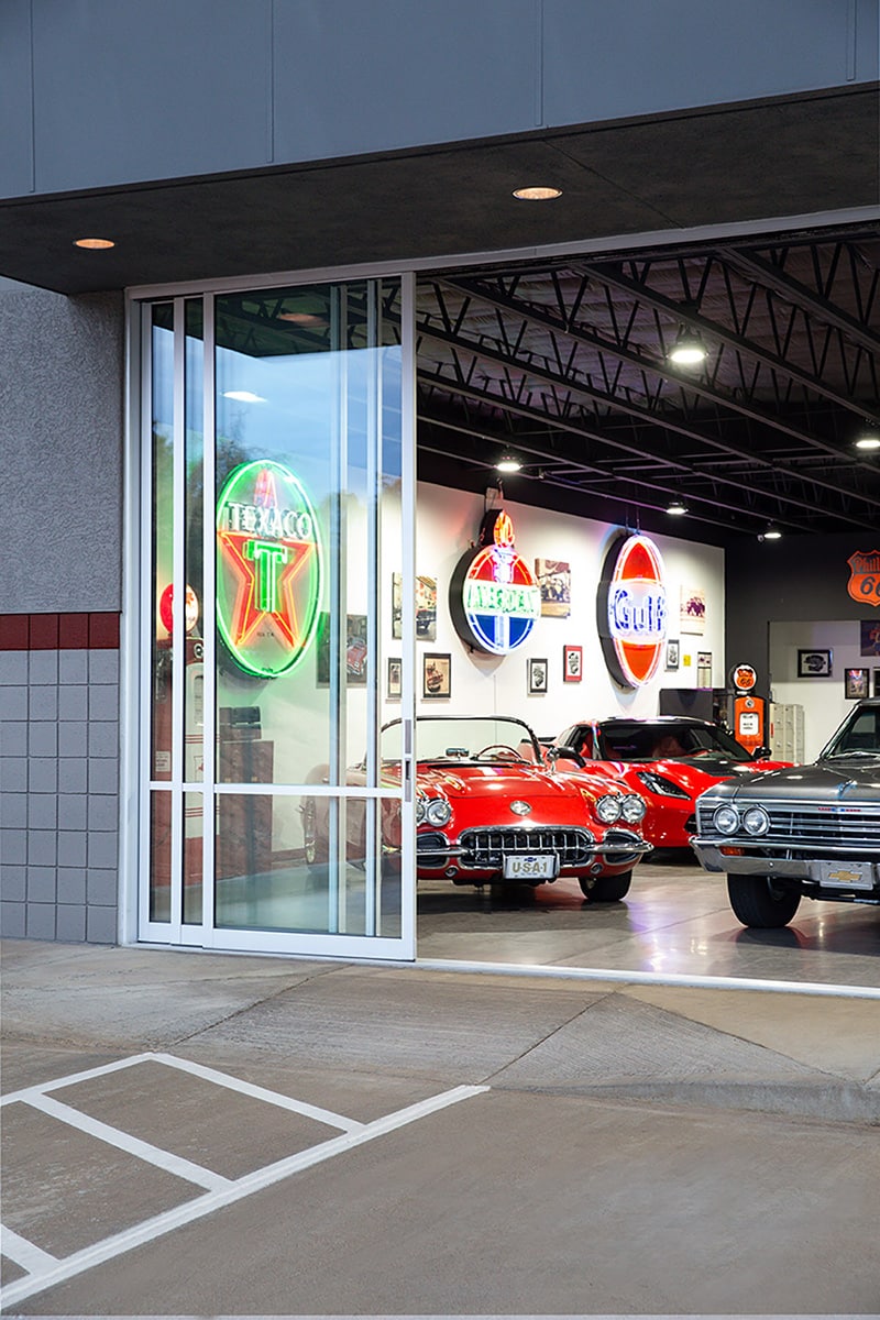 The special sills that enable vehicles to roll in and out of the showroom blend right in with the sliding glass doors.