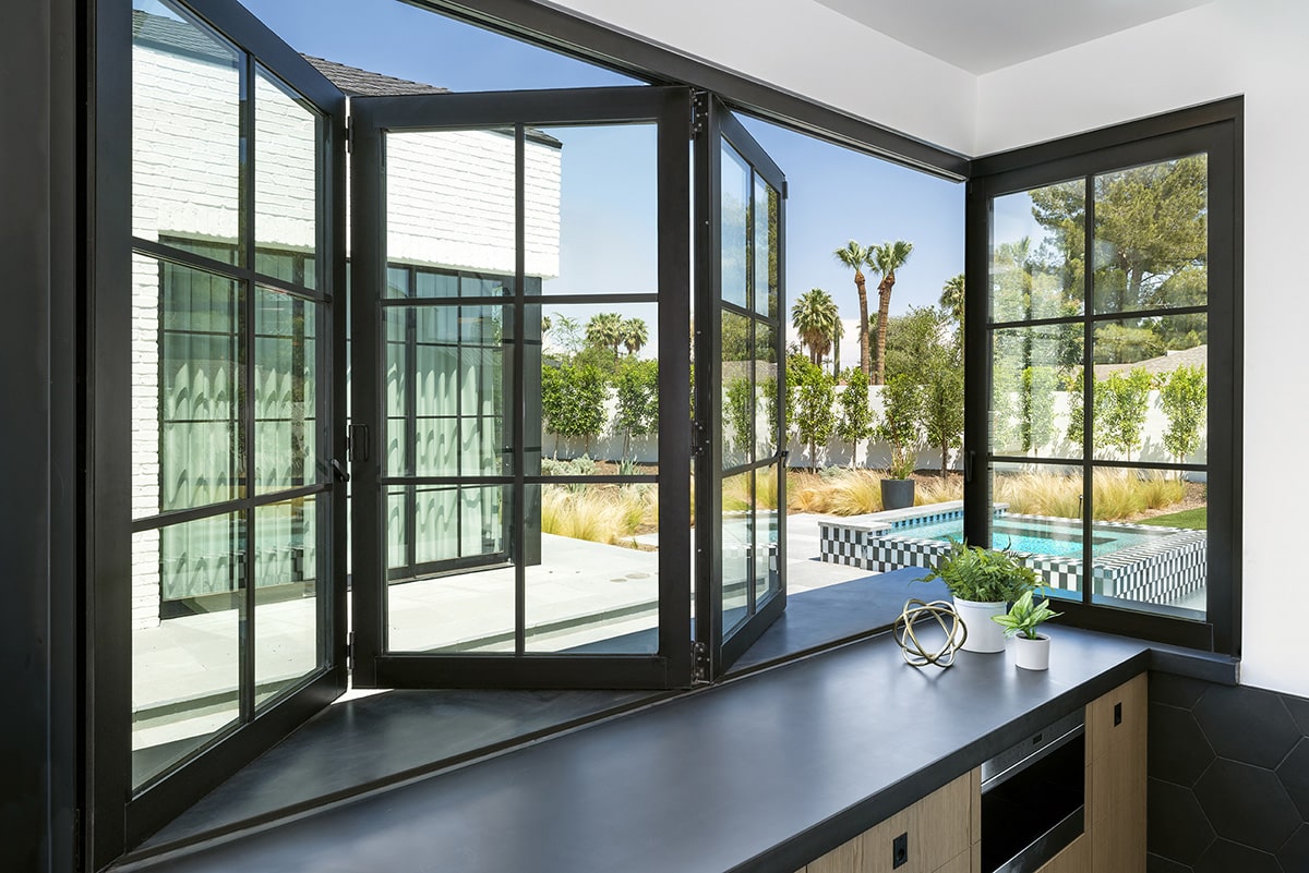 The Bi-Fold window over the kitchen bar lets guests outside enjoy an ice-cold beverage without having to go inside.