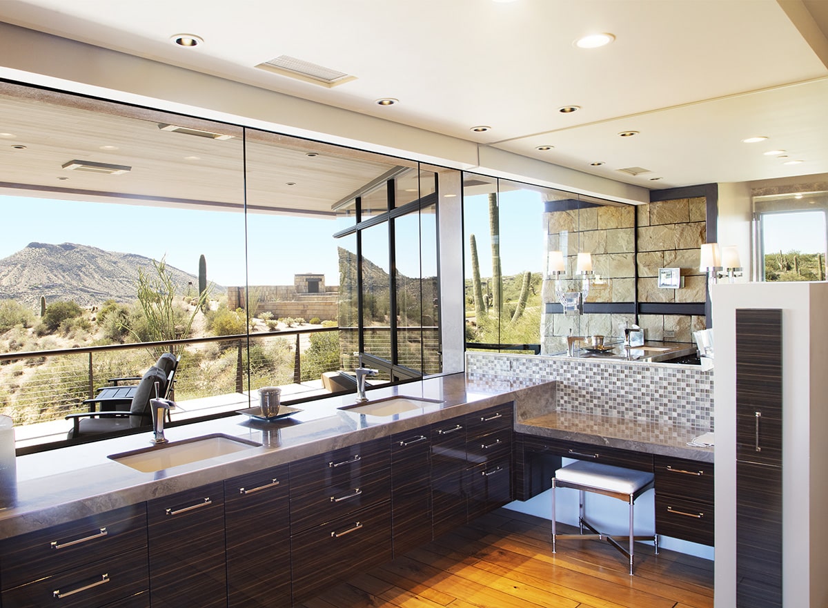 Fixed windows, instead of the traditional mirror, allow for spectacular views in the master bath.