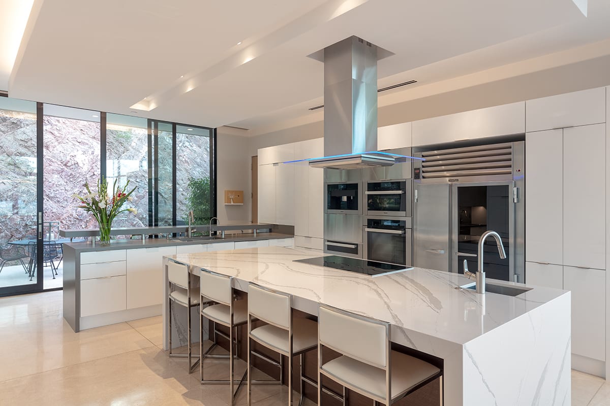 Massive glass doors provide up-close views of the mountain next to the kitchen.