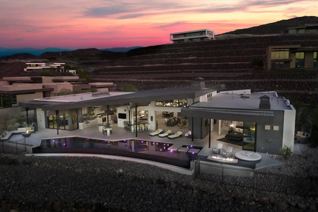 A top-down view of a Las Vegas home nearly completely open to the backyard through sliding glass doors.