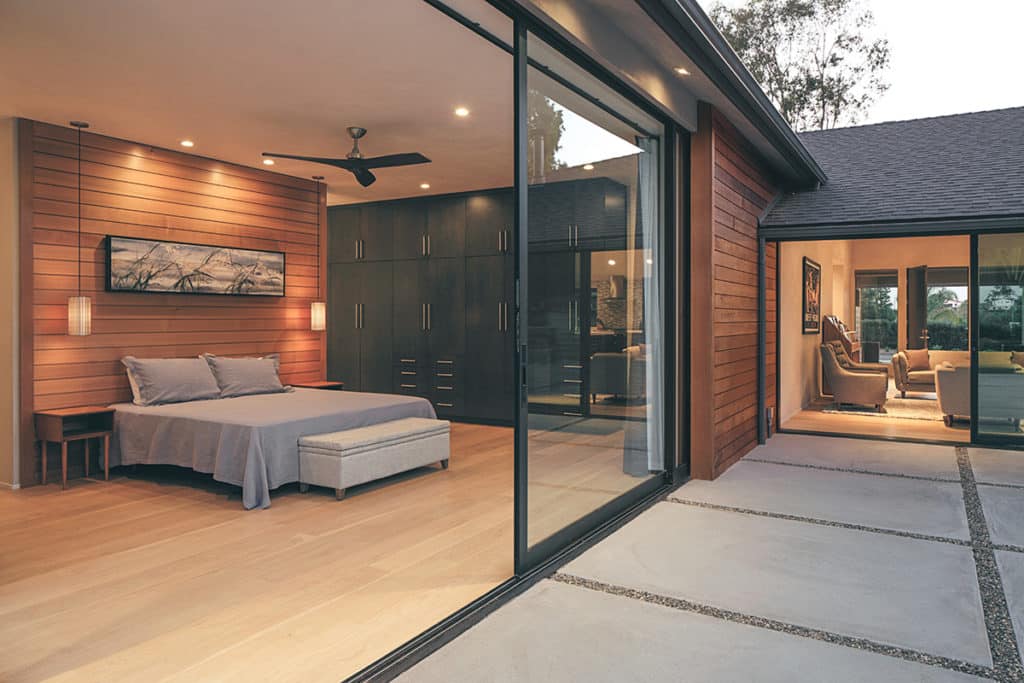 This room completely connects to the outdoor patio through a floor-to-ceiling multi-slide door.