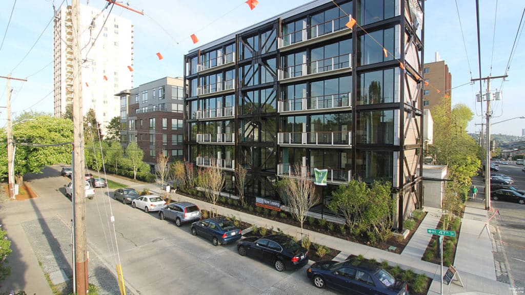 The nearly all glass building also includes Series 900 Hinged Doors with a operable awnings.