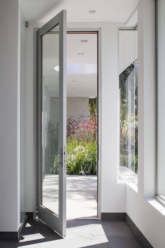 A close-up view of the handle and locking system on a large, hinged door.