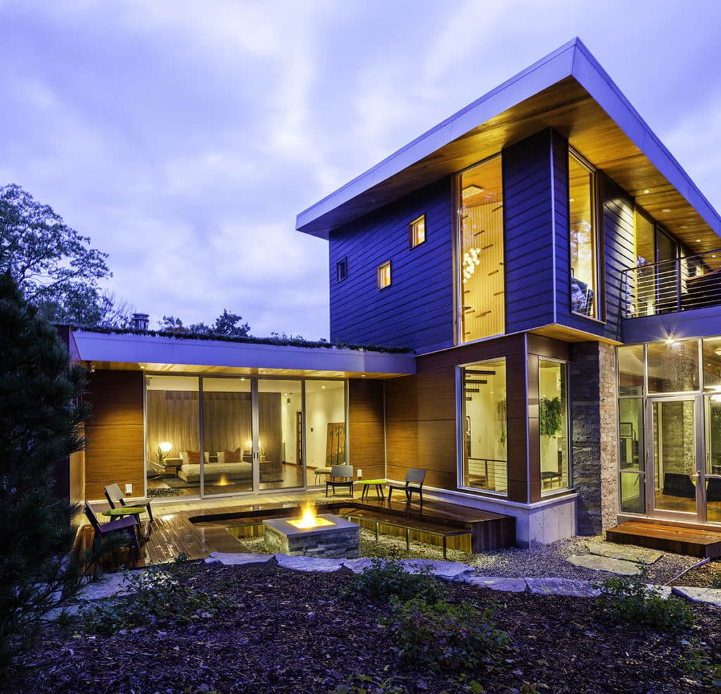 When open, the bi-parting sliding glass door in the master bedroom blurs lines between the indoors and the outside pool and lounge area.