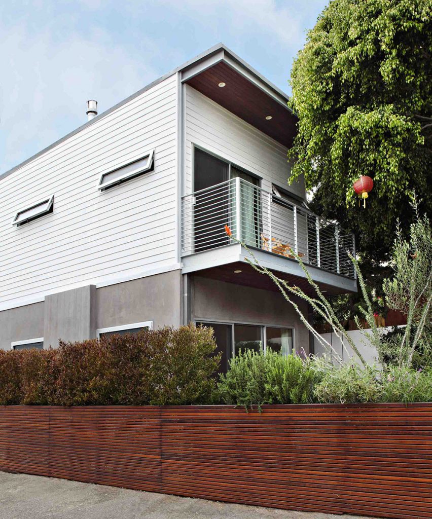 A sliding glass door leads from the master bedroom to a deck overlooking the back patio.