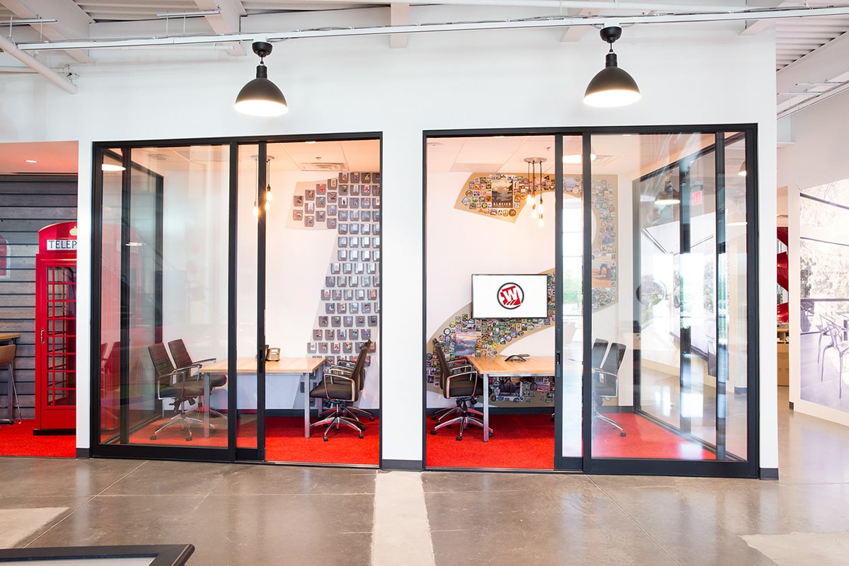 Two of the company's themed mini-conference rooms are accessible via giant sliding doors.