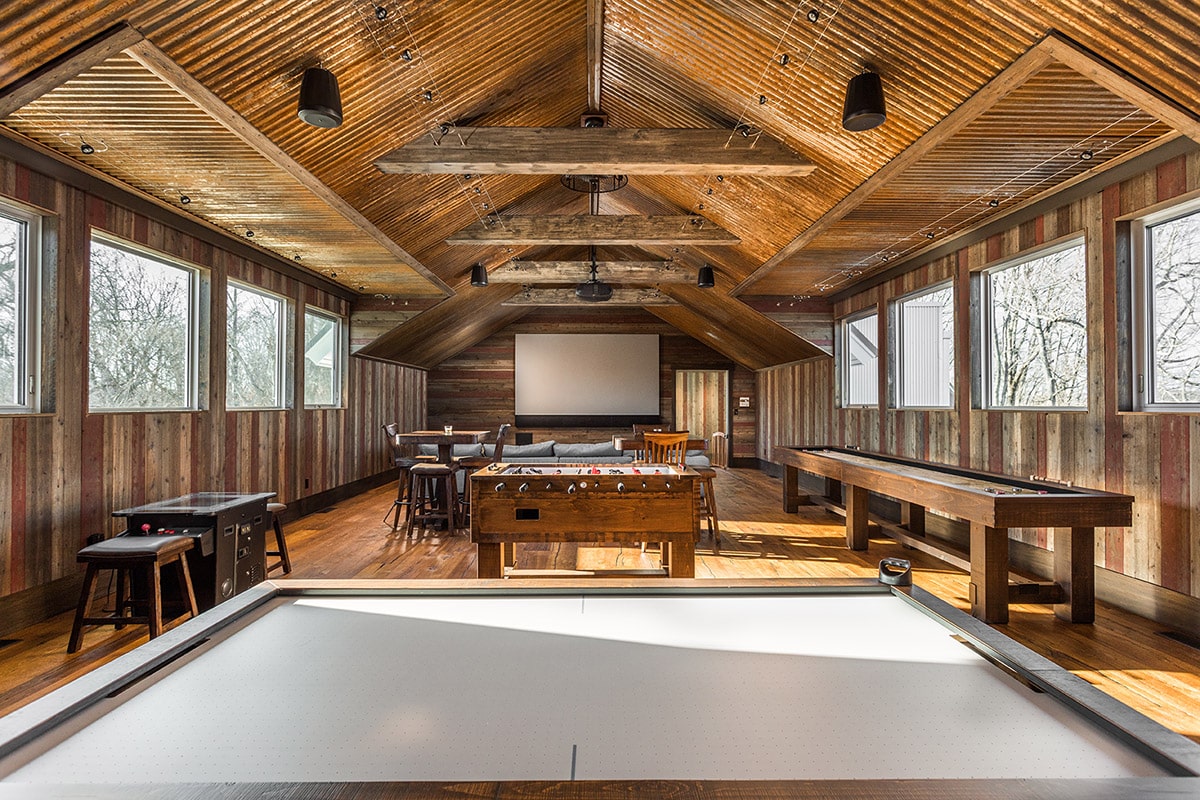Banks of windows in the second-floor rec room give gamers loads of natural light.