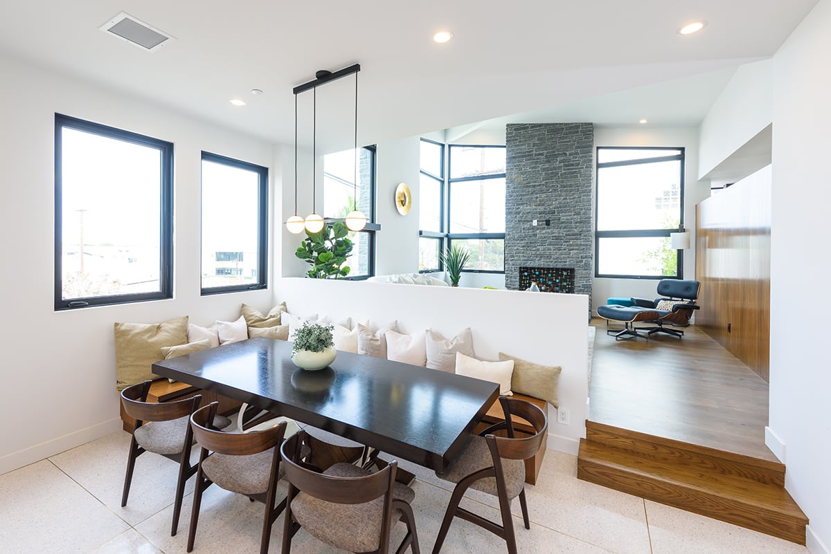 Tasteful interior design meets a contemporary aesthetic found in Western Window Systems products through minimal design in this dining room.