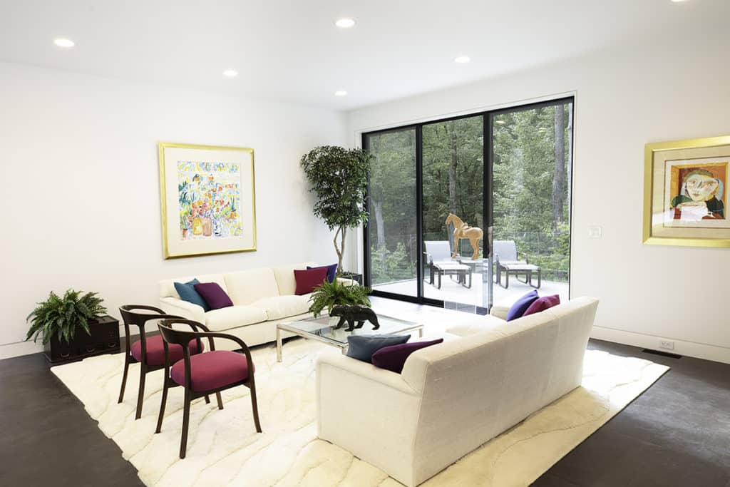 A Series 600 Multi-Slide Door provides a seamless flow from the interior seating area to the exterior.