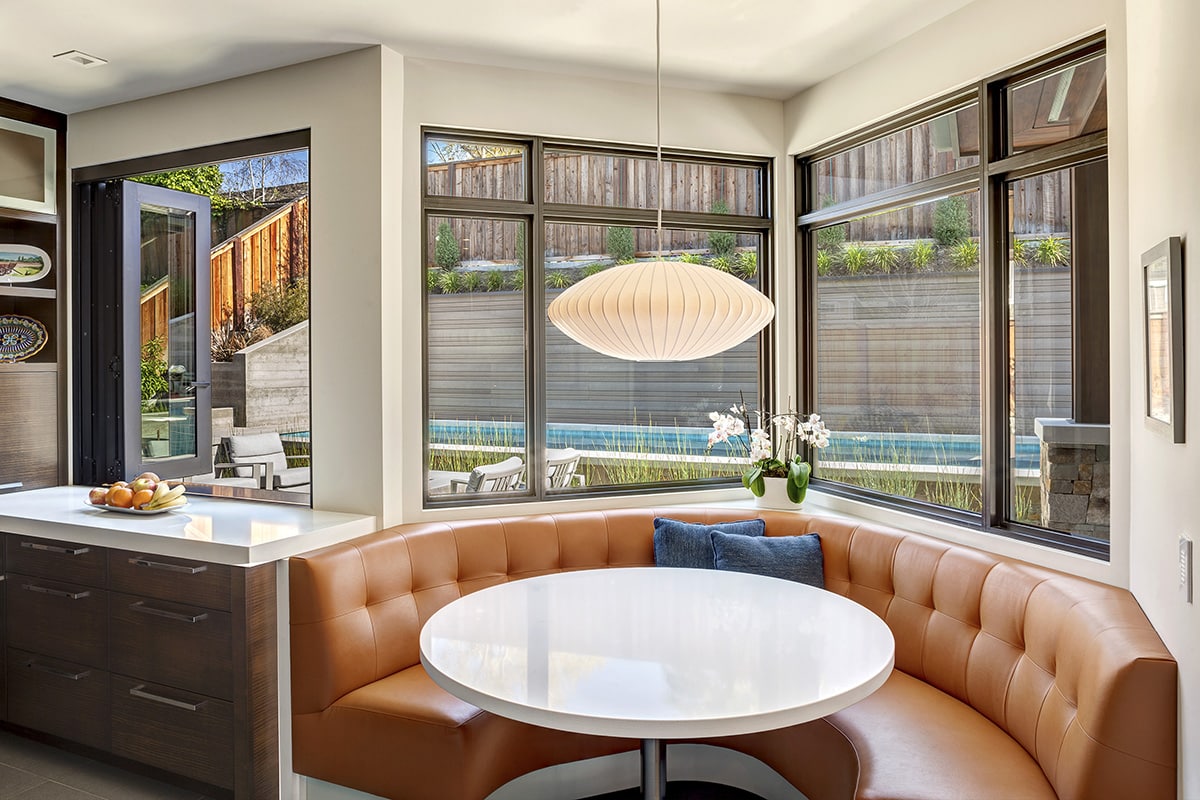 Another V-shaped popout in the breakfast nook complements a bi-fold pass-through window in the kitchen.