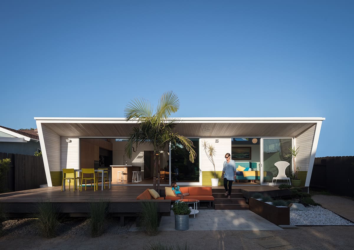 A multi-slide door combined with a sliding glass door across the back of the house provides the ultimate indoor-outdoor living experience.