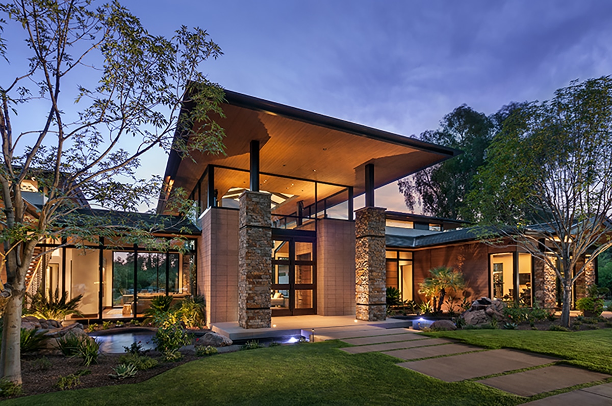 A view of the glass entrance with clerestory windows that make the roof feel as if it’s floating.
