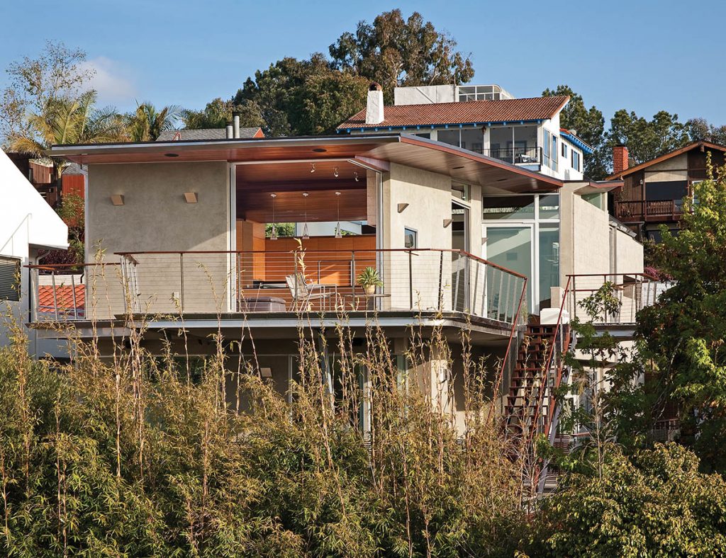 A pocketing 90-degree sliding glass door makes the sunny kitchen space even more expansive when completely open and connecting to the balcony.