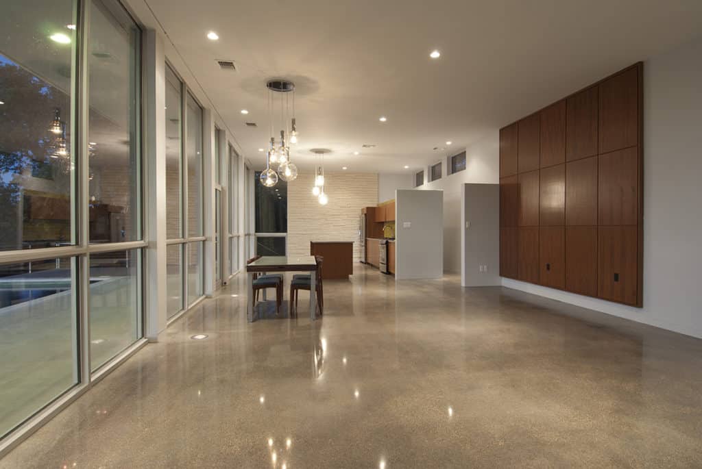 The massive window wall runs alongside the dining room and kitchen areas.