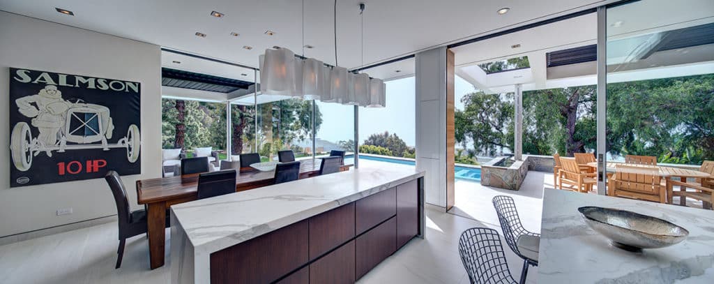 The kitchen and dining area can virtually merge with the patio thanks to the Western Window Systems doors.