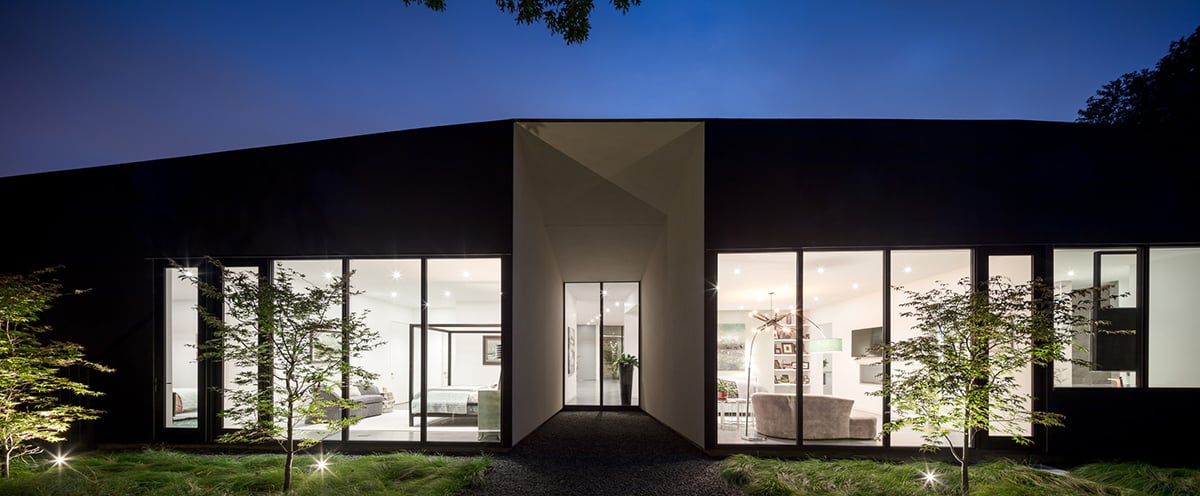 A front view of the huge expanses of glass that abound in the stunning residence.