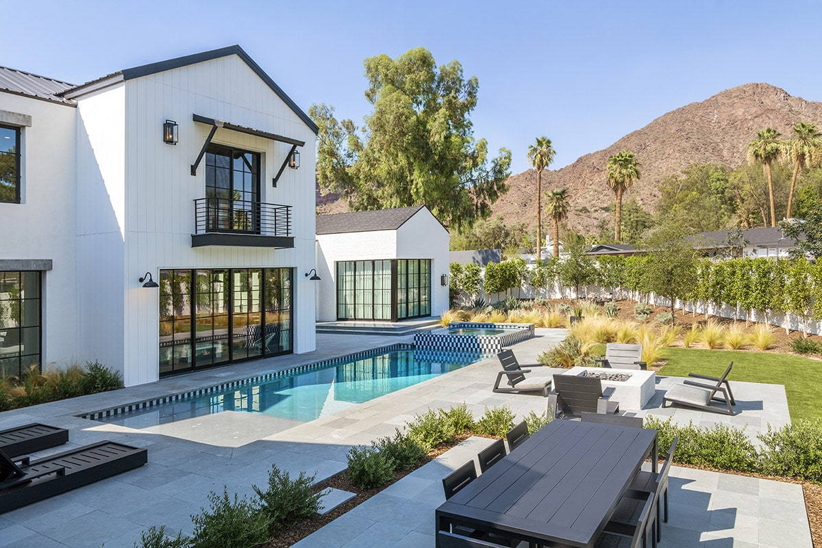 Sliding glass doors on both levels of the house opens spaces to the desert landscaping and social areas outside.