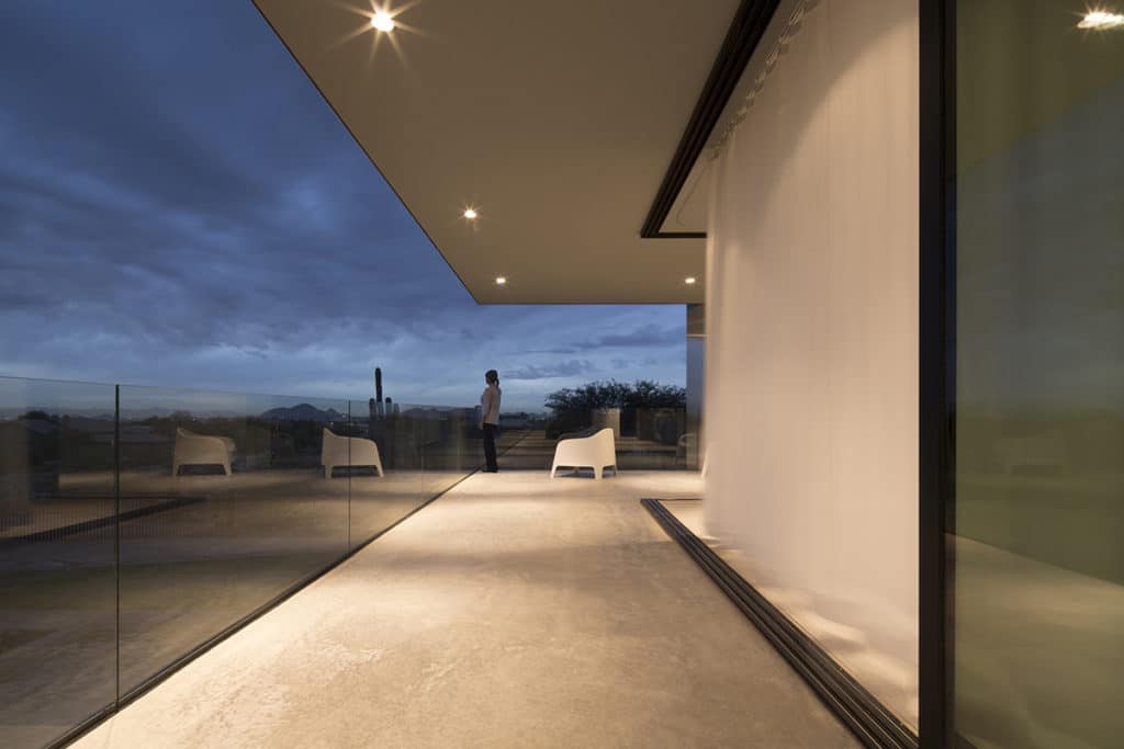 The master bedroom and balcony become one when the 90-degree multi-slide doors are opened.