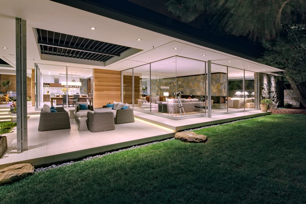 An unbeatable view of the glassy home from the backyard.