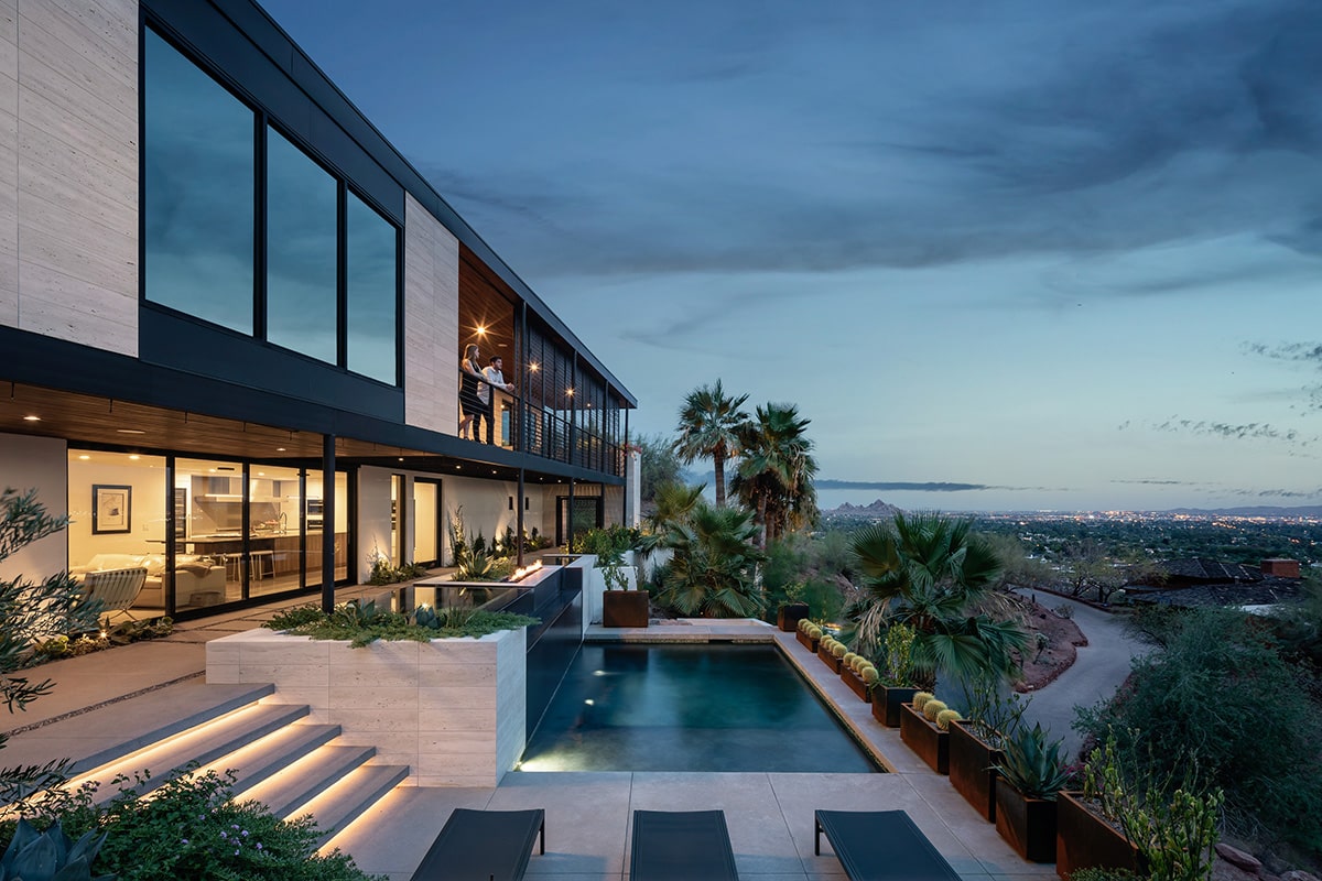 The second-floor balconies connect to views of the resort-like patio and majestic Camelback Mountain.