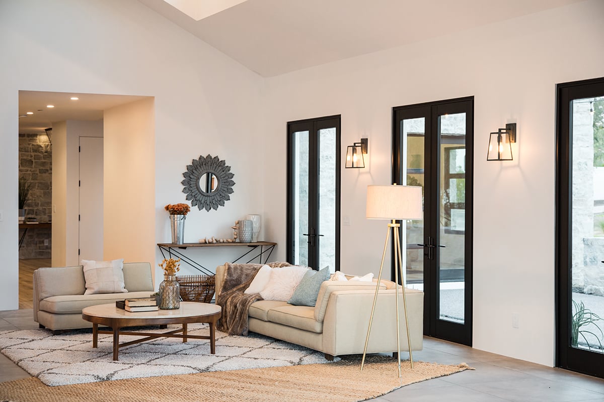 A trio of hinged double doors in the front of the house.