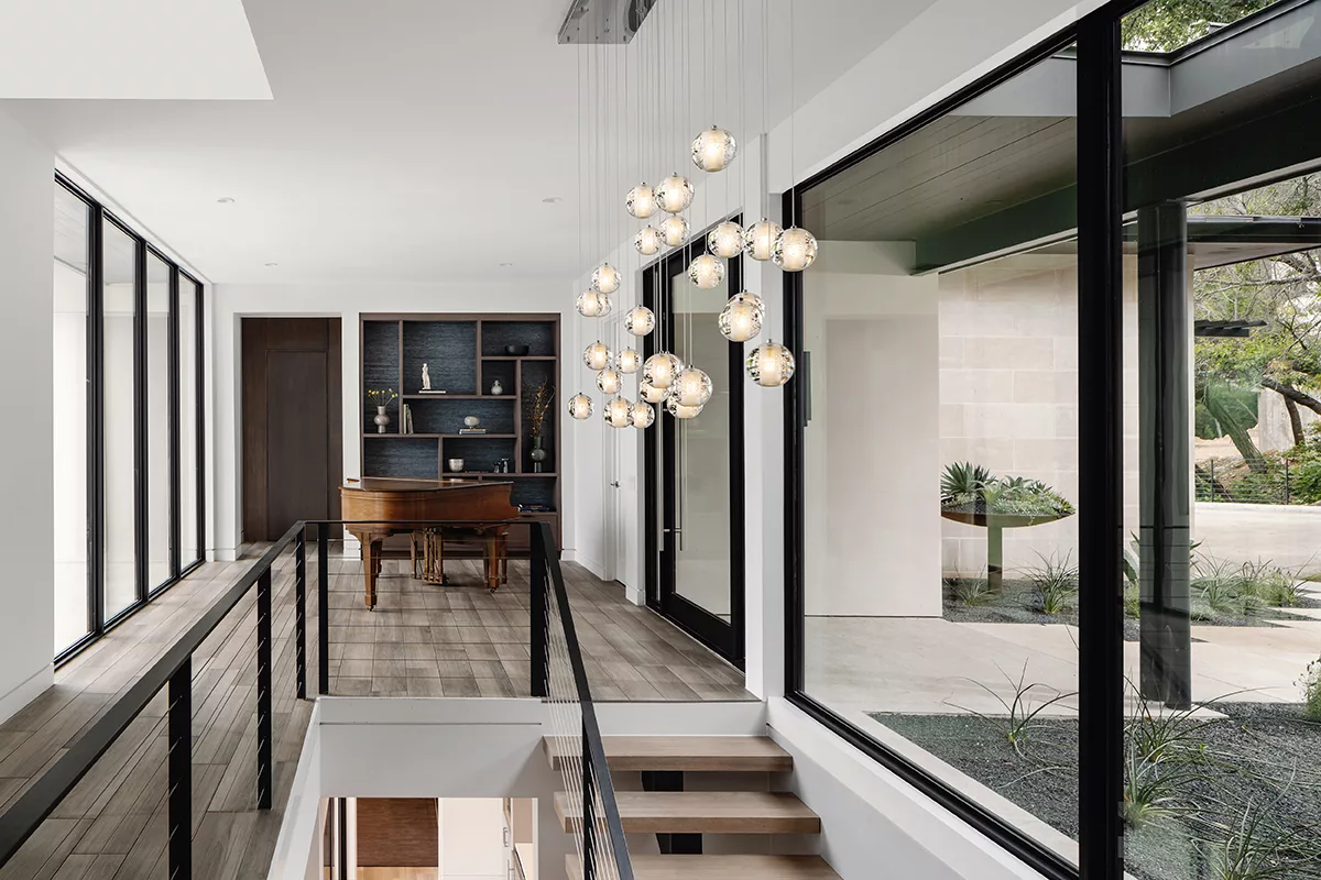 The glass filled entryway brings in natural light.